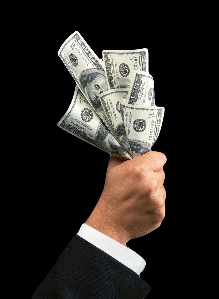 Investment resources held in a hand